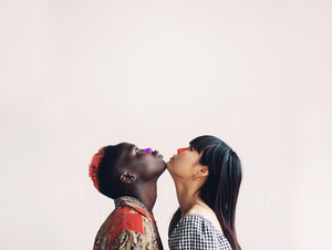 Woman and man wearing Nöz face sunscreen in shades purple and orange.