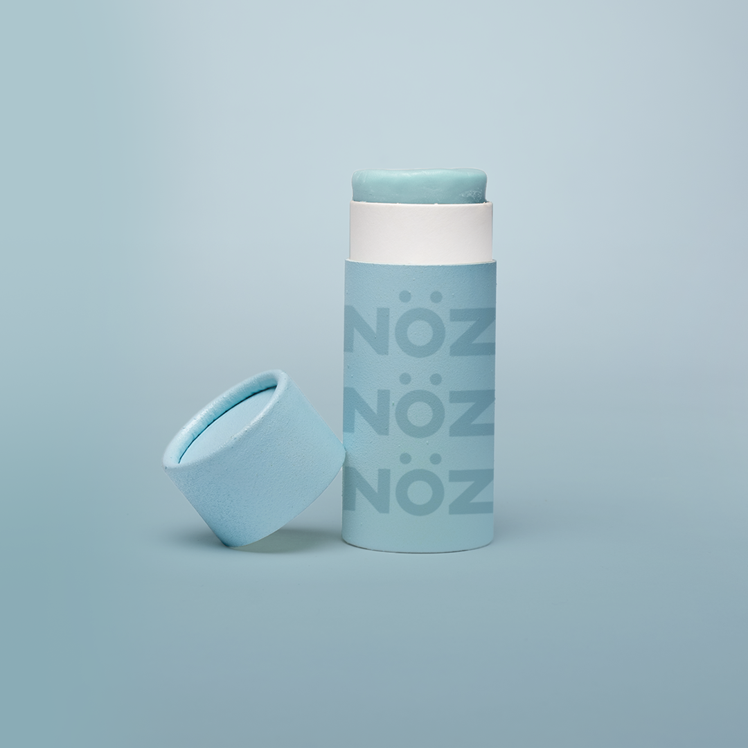 Nöz sunscreen tube with the lid off in shade blue.