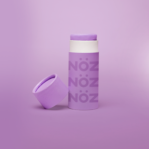 Nöz sunscreen tube with the lid off in shade purple.