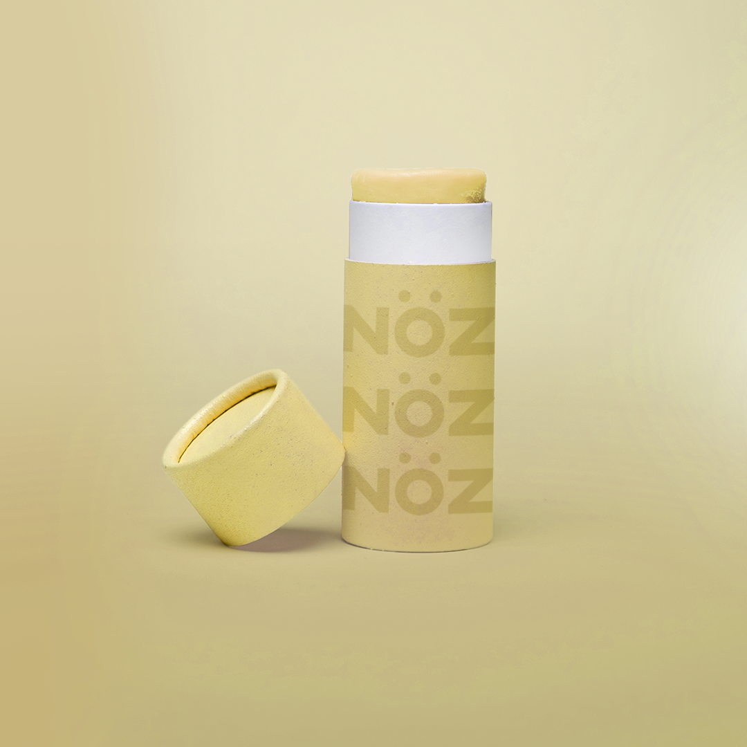 Nöz sunscreen tube with the lid off in shade yellow.